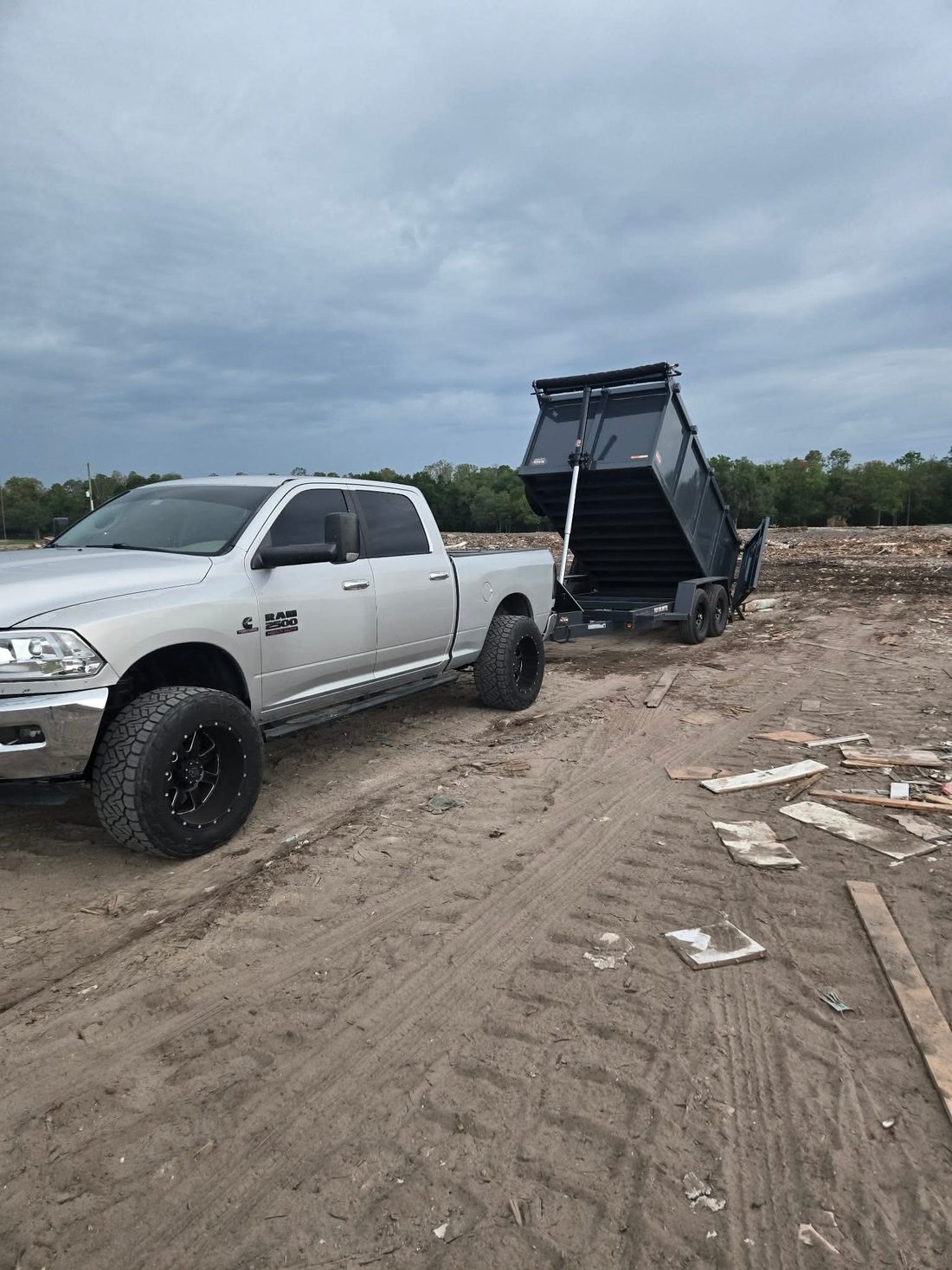 Lance & Load truck and dump trailer on a junk removal and yard debris job near Hudson, Florida